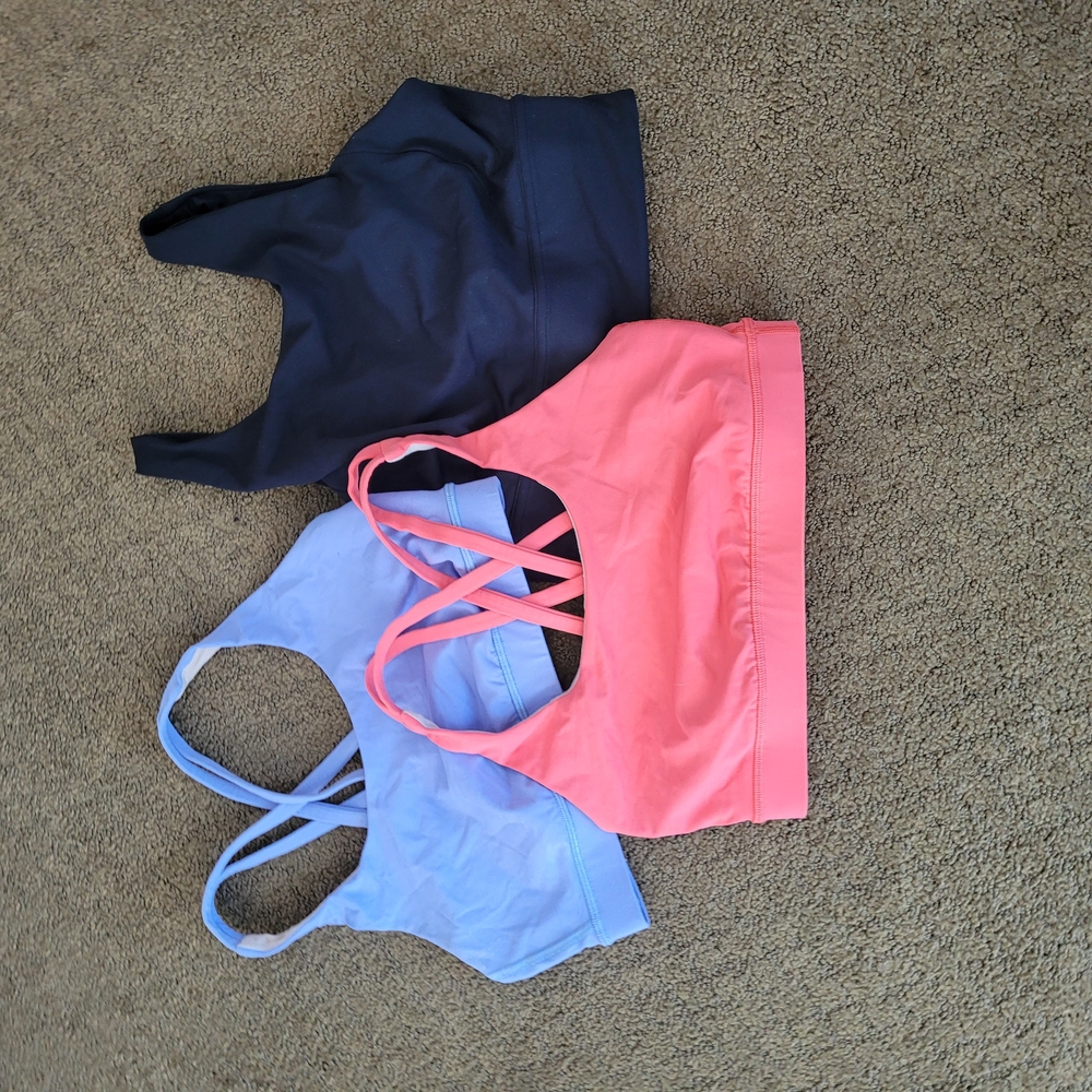 Set of Three Lululemon Sports Bras in Pink, Blue, and Black